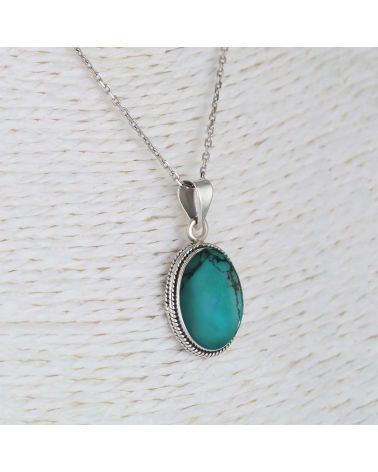 Pendentif Turquoise sertie collerette d'argent massif